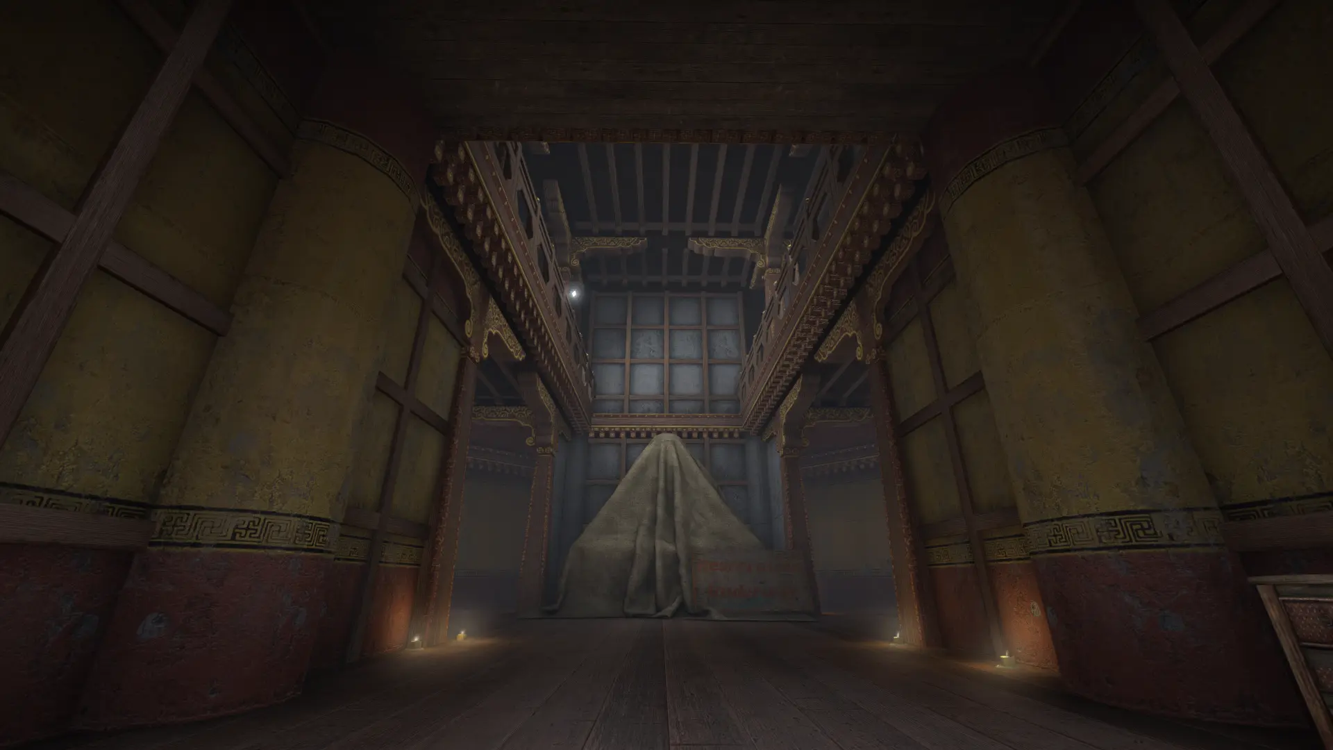 Dim temple hall with carved pillars and a cloth-draped altar