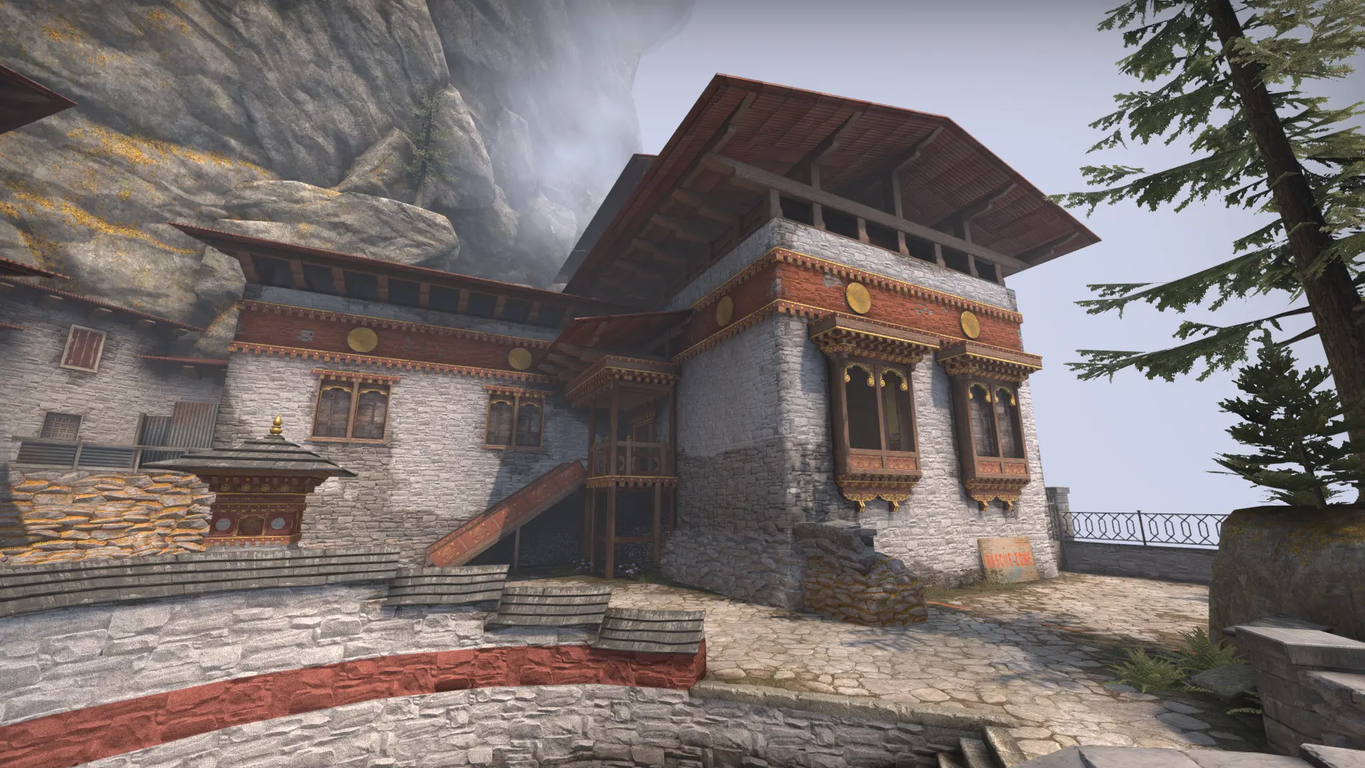 Bhutanese dzong building with golden windows and red banners