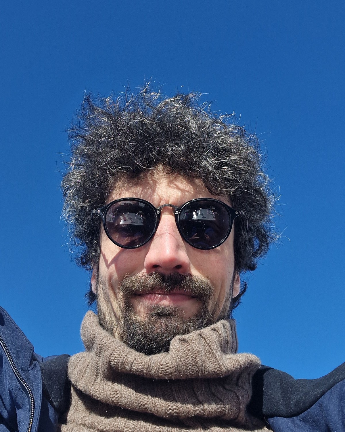 Portrait of Michael Jako against a blue sky
